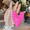 Estilo Coreano Ins Dulce Estilo Girly Relleno de Algodón Corazón Cadena de Perlas Colgante de Bolso Accesorios para Bolsos Llavero Colgante Pequeño