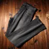 Estación europea primavera y verano fino importado mezclilla lavado a piedra molino gris ahumado elástico recto ajustado delgado jeans moda hombre