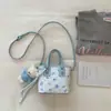Bolso de mano para mujer para salir, nuevo modelo primavera-verano 2026, de alta gama, moderno, versátil, de un solo hombro, bandolera tipo cubo