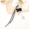 Llavero con colgante de lazo de cuero con borlas estilo coreano, accesorio colgante para pareja