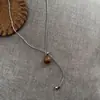 Acero de Titanio Sentido del Diseño Ojo de Tigre Cadena de Tirar Perla Barroca Personalidad de Nicho Mismo Collar que Blogger Cadena de Lana