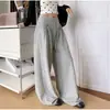 Pantalones anchos de lunares negros estilo coreano para mujer, adecuados para primavera y otoño, con caída fluida, cintura con cordón, tiro alto y un estilo relajado y casual con estampado floral