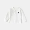 Ropa Infantil 2026 Primavera Nuevo Estilo Camiseta de Manga Larga de Algodón Puro para Niños Atuendo de Primavera de Moda Camisa Base de Exportación Europea y Americana Venta al por Mayor
