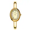 Relógio Pulseira GEDI Retrô Oval Dourado para Mulheres Números Romanos Mostrador Cravejado com Diamantes Leve Integrado Luxo de Nicho para o Dia a Dia Relógio de Quartzo