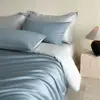 Juego de cama de cuatro piezas de alta gama Clase A con 100 hilos, algodón de fibra larga de Xinjiang, 100% algodón, con sábana bajera, para uso doméstico y dormitorios estudiantiles, juego de tres piezas