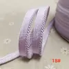 En stock 48 colores poliéster velcro con borde de cordón ribeteado tira de inserción de cuerda para ropa colchas sofás cojines tira de ribete