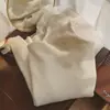 Suéter de capa base de cuello alto otoño e invierno nuevo estilo top de cuello de pelo jersey de manga larga tejido elegante ajuste ceñido tejido de punto blanco