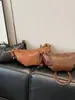 Bolso croissant vintage de nicho 2026 verano nuevo estilo ins para el trabajo bolso de hombro para teléfono bolso cruzado bolso de albóndiga moderno