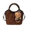 Bolso tipo cubo de moda este año con estampado de leopardo para mujer, un nuevo estilo nicho para ir al trabajo, chic y casual, acabado mate, bolso de hombro versátil