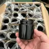 Fabricantes de Botellas de Vidrio al por Mayor Múltiples Capacidades Violeta Negro Material Opaco a la Luz Botella para Cremas Botella Cosmética Botella de Cáñamo