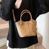 2026 Nueva Moda Coreana Bolso Cubo Estilo Cesta Versátil Bolso de Mano Textura Granulada Simple Bolso de Hombro Moderno