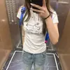 Camiseta Branca Gola Redonda Estampa de Letras Manga Curta Regular Ombro Estilo Americano Pura Vontade para Mulheres Verão 2026 Top Slim Fit Hot Girl