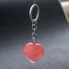 Llavero de cristal rosa natural con gema de cristal de 30 mm, colgante de amor, corazón de melocotón en forma de corazón, colgante de piedra natural. Fabricantes transfronterizos.