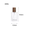 Al por mayor en stock Múltiples especificaciones y estilos Botella dispensadora de perfume simple y portátil Botella rociadora Botella dispensadora cosmética Tapa de madera