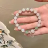 Pulsera de Piedra Ojo de Gato Imitación, Diseño de Nicho, Accesorio de Mano Simple y Elegante para Mujer, Nueva Pulsera de Alta Gama de Moda 2026