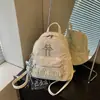Mochila de mezclilla de moda transfronteriza con borlas, estilo nuevo 2026, mochila escolar elegante y simple con un ambiente dulce y femenino