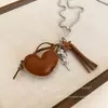Collar Colgante Cruz de Cuero Maillard para Mujer Cadena Larga con Borlas para Suéter Diseño Dulce Fresco Cadena para el Cuello
