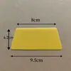 Raspador de película de plástico pequeño, herramienta trapezoidal amarilla para película de automóvil, además de raspador de película de teléfono móvil con burbujas, venta al por mayor