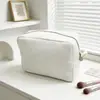 Bolsa de maquillaje de patrón gofre más vendida transfronteriza, bolsa de aseo de viaje portátil de gran capacidad, bolsa de almacenamiento de color sólido de alto valor