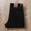 Pantalones casuales rectos holgados de algodón lavado elástico de sarga de alta gama para hombre, versátiles para negocios y trabajo, otoño e invierno 2023