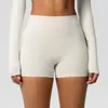 En stock shorts de yoga de color sólido a doble cara cepillados de cintura alta ajustados que realzan los glúteos para mujer, adecuados para correr y actividades de fitness