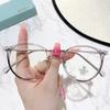 TR8912 Montura redonda pequeña de moda coreana TR90, espejo plano liviano para hombres y mujeres, montura de gafas para teléfono móvil retro anti-luz azul