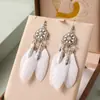 Pendientes de Pluma de Hoja de Loto Multicapa Estilo Étnico Aleación Casual Pendientes de Yunnan Venta al por Mayor Pendientes de Joyería Étnica Creativa