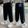 Pantalones para niños 2026 primavera y otoño estilo nuevo pantalones deportivos holgados para niños mayores, amigables con la piel y cómodos, pantalones casuales de moda con puños elásticos