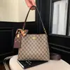 Bolso Cubo de Moda Versátil con Estampado Retro para Mujer 2026 Nuevo Modelo de Alto Valor Simple Casual para Viajes Diarios Bolso de Hombro Cruzado