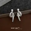 Pendientes de borla con lazo incrustado de circonita, a la moda y sofisticados, estilo dulce y fresco único, nueva cadena de suministro de pendientes de fábrica