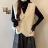 Elegante y chic chaleco de punto asimétrico con cuello en V para mujer, una nueva pieza casual de otoño/invierno que se puede combinar fácilmente con suéteres y otras prendas superiores.