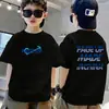 Camiseta de algodón puro de manga corta para niños, nuevo estilo de verano con estampado de letras de dibujos animados, top holgado de moda para bebé de media manga