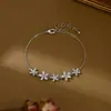 Estilo Nuevo Primavera y Verano Zirconia Micro-pavimentada Temperamento Joyería de Mano Diseño de Nicho para Mujer Pulsera de Ojo de Gato Pétalo Pulsera Versátil