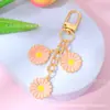 Estilo Ins Flor de Margarita con Goteo de Aceite Borla Llavero Creativo Colgante para Bolsa de Auriculares de Niñas Venta Caliente