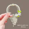 Novo Estilo Chinês Novo Clipe de Cabelo Bola de Flores Feminino Asas Borla Fivela de Rabo de Cavalo Parte de Trás da Cabeça Adorno de Cabelo