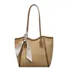 Bolsa tote de gran capacidad para mujer, nuevo modelo 2026, bolso de hombro simple, bolsa tejida versátil de nicho para el trabajo y los desplazamientos
