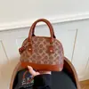 Bolsa Nova Outono 2026 Bolsa Concha Estilo Retrô Luxo Leve Moda Tendência Versátil Bolsa de Ombro Transversal Bolsa Feminina
