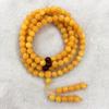 Pulseira de flor amarela flutuante de óleo de galinha de cera de abelha de segunda geração pulseira de cabeça de Buda pulseira de mel velho rosário de âmbar pulseira de contas redondas atacado