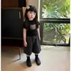 Verão 2026 Novo Estilo Popular Fofo Preto Desenho Animado Camiseta Manga Curta Calça Jeans Capri Conjunto