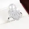 Anel de Pérola Branca Estilo Europeu e Americano Transfronteiriço Live Fashion com Design Detalhado de Pena, Zircônia, Anel de Cobre Puro Joias Atacado