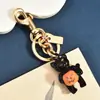 Llavero de Gato Negro Sosteniendo Calabaza de Halloween Transfronterizo, Encantadora Artesanía de Esmalte, Colgante de Bolsillo Estilo Festivo, Accesorio Versátil Personalizado