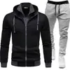 25 estilos de chaquetas deportivas para hombre de otoño e invierno con empalmes, conjuntos deportivos casuales de dos piezas para hombre con capucha, manga larga y pantalón largo