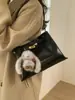 Bolso Pequeño Retro de Alta Gama Transfronterizo Otoño e Invierno para Mujer 2026 Nueva Moda Versátil Bolso Cruzado Bolso de Mano Bolso Cubo