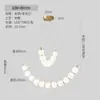 Lámpara colgante minimalista francesa con forma de frijol curvado, decoración de bola blanca lechosa de moda, lámpara colgante lineal larga para mesa de isla de comedor