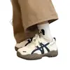 Sapatos brancos de sola grossa femininos 2026 novo estilo estilo esportivo com cadarço cano baixo casuais tênis de skate sapatos femininos Forrest Gump