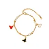 Pulsera de Mariposa de Doble Capa Estilo Europeo y Americano Chapada al Vacío en Oro de 18 Quilates Joyería de Acero Inoxidable de Alta Gama