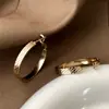 Pendientes Circulares de Café Dorados con Textura Exquisita, Minimalistas Europeos y Americanos, Pendientes de Estilo Commuter de Alta Gama y Lujo Ligero con Personalidad y Temperamento para Mujer