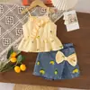 Conjunto infantil de verão transfronteiriço para férias na praia, apresentando um top regata e calça saia com laço, doce e fofo, em estoque