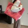 Bolso de lona con letra y borla minimalista para comercio exterior, bolso de mano de gran capacidad, nuevo bolso tote de hombro de color liso para uso transfronterizo