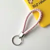 Llavero creativo llavero de cuerda de cuero cordón para llaves colgante de joyería cordón tejido fábrica de cuerda de cuero venta al por mayor